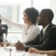 youth job/career training and development, education and training grants; young employee raising hand